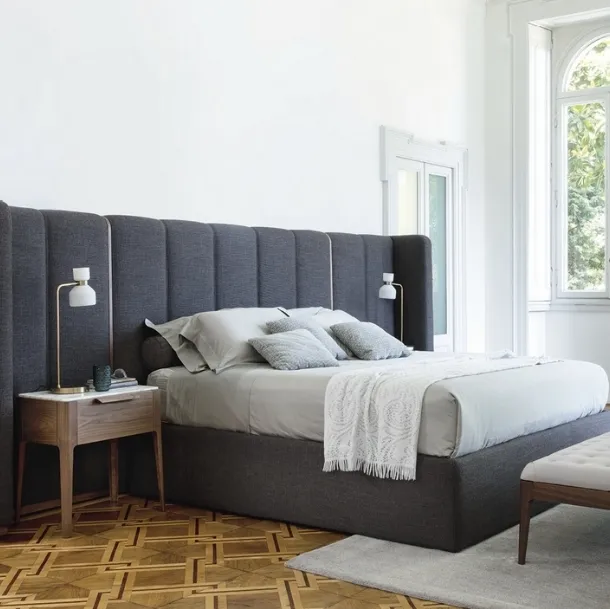 Bed with Aida headboard by Porada