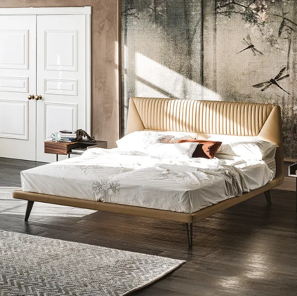 Bed with contoured padded headboard upholstered in Amadeus faux leather by Cattelan Italia