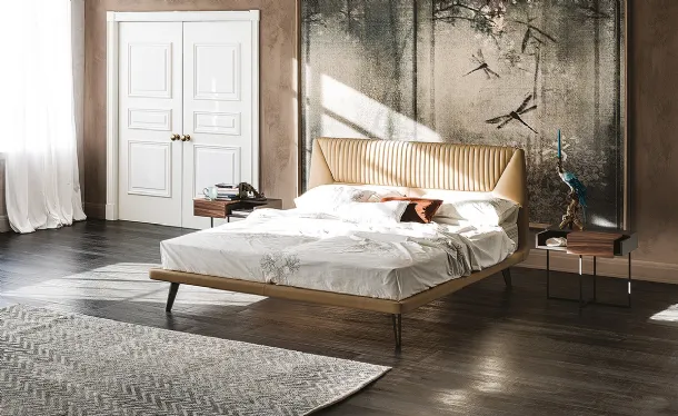 Bed with contoured padded headboard upholstered in Amadeus faux leather by Cattelan Italia