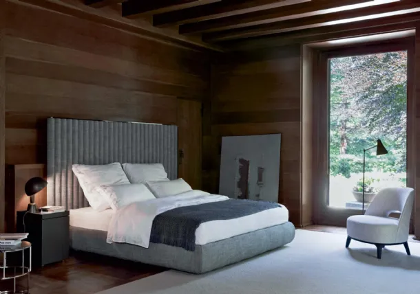 Upholstered fabric bed with Biarritz headboard by Flexform