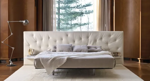 Bed with a wide quilted fabric headboard Chance Up by Desirèe