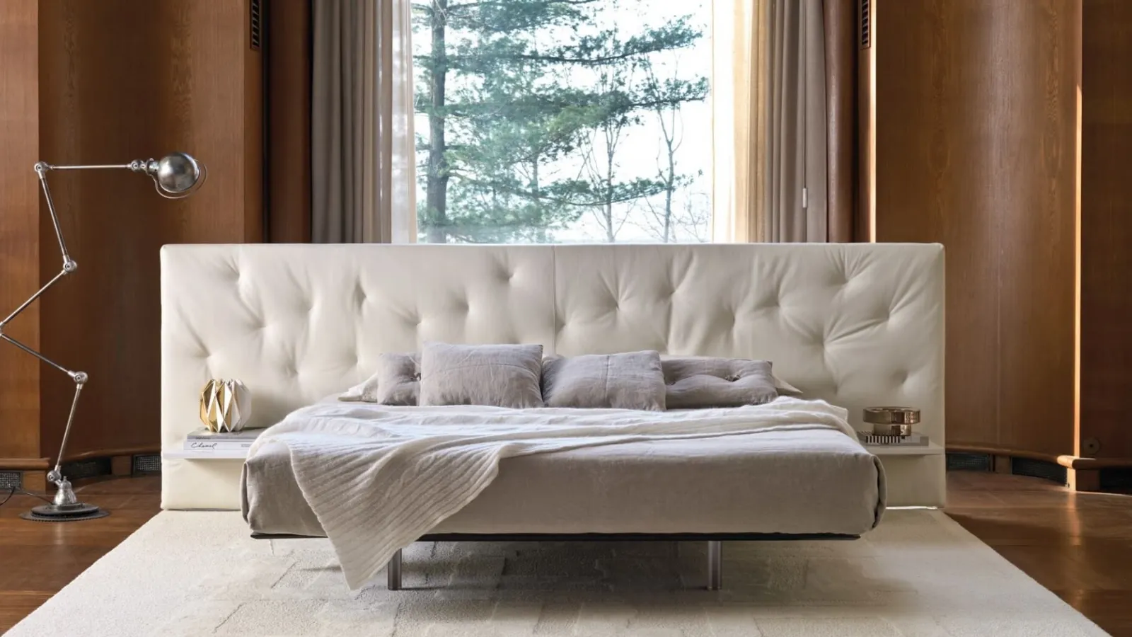 Bed with a wide quilted fabric headboard Chance Up by Desirèe