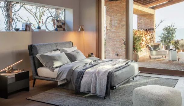 Fabric bed with Gaudì wooden frame by Flou