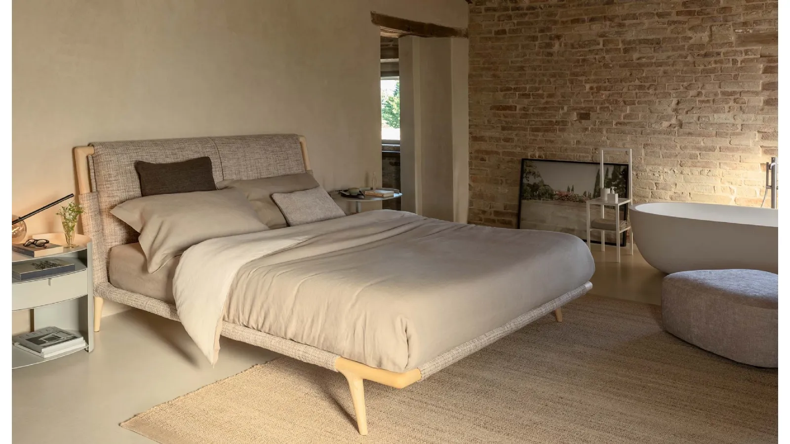 Fabric bed with Gaudí wooden frame by Flou