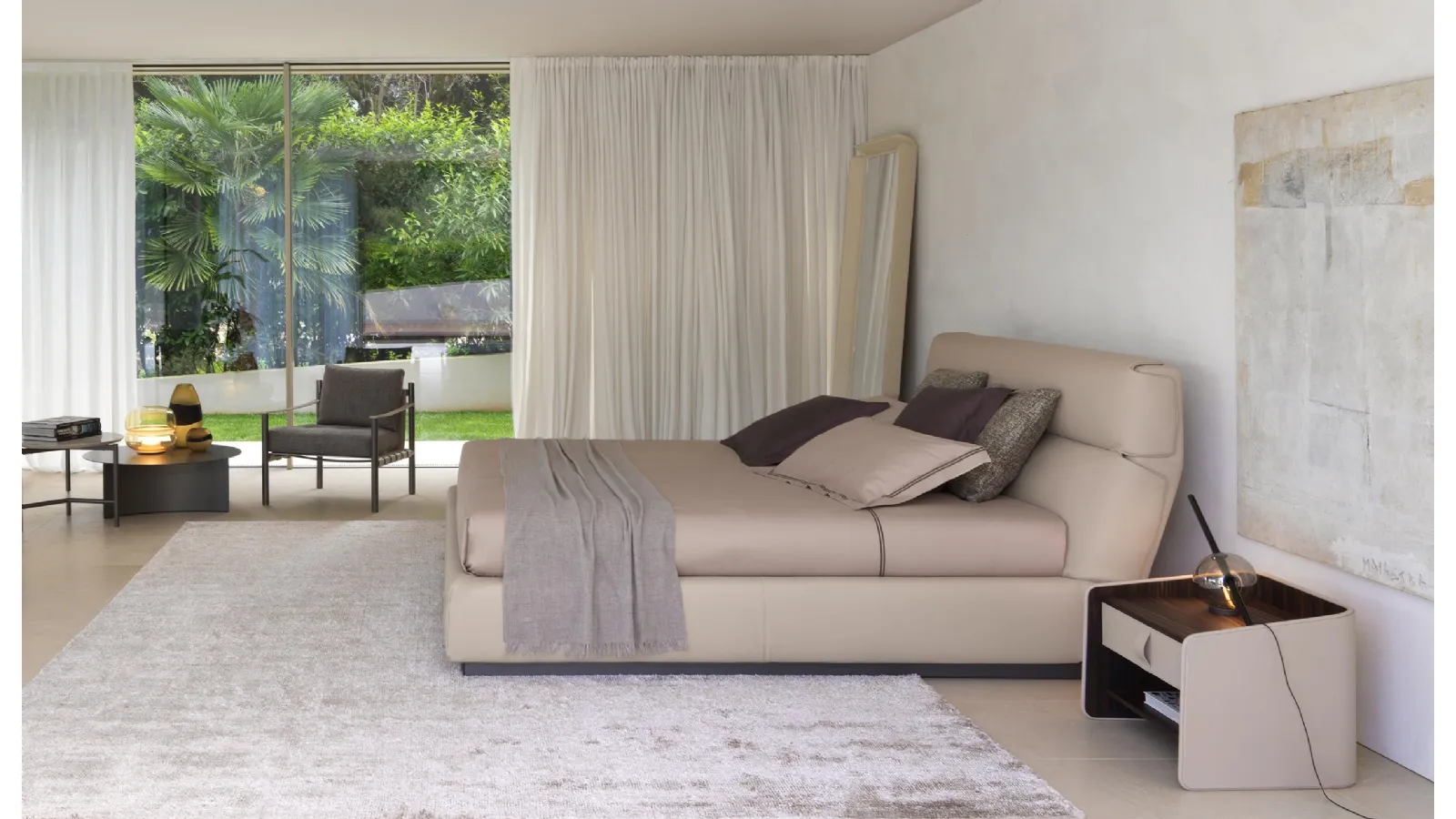 Gentleman leather bed with high headboard by Flou