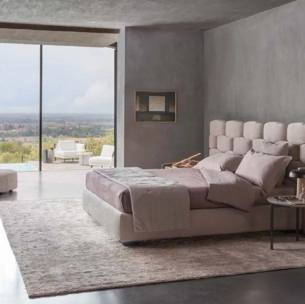 Majal fabric bed with wide headboard by Flou