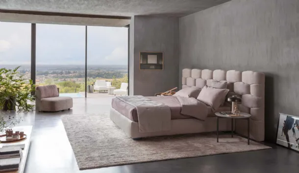 Majal fabric bed with wide headboard by Flou