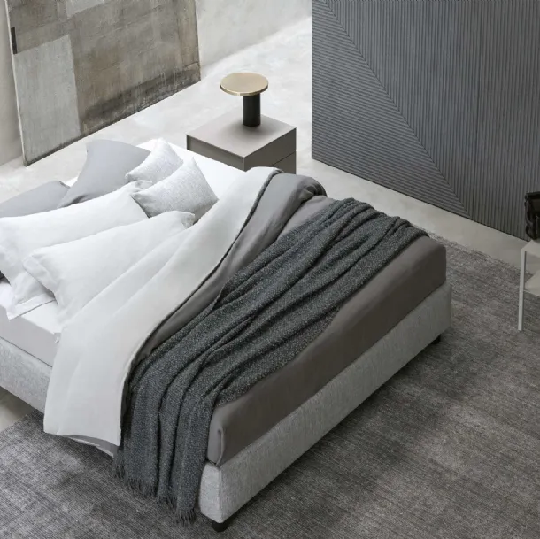 Sommier bed in fabric, simple and versatile with storage by Flou