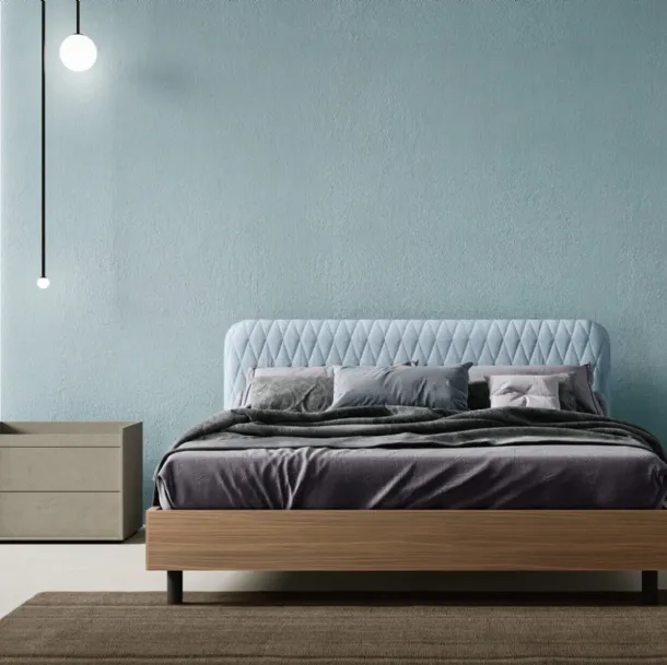 Wing Bed with quilted fabric headboard by Zalf