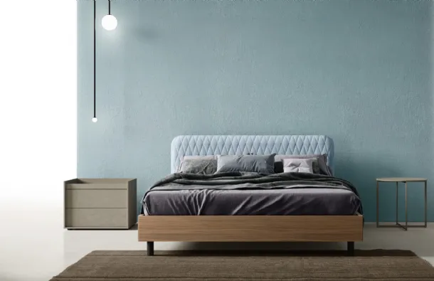 Wing Bed with quilted fabric headboard by Zalf