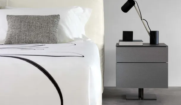 Juta High Nightstand with matte lacquered finish and central metal leg by Flou