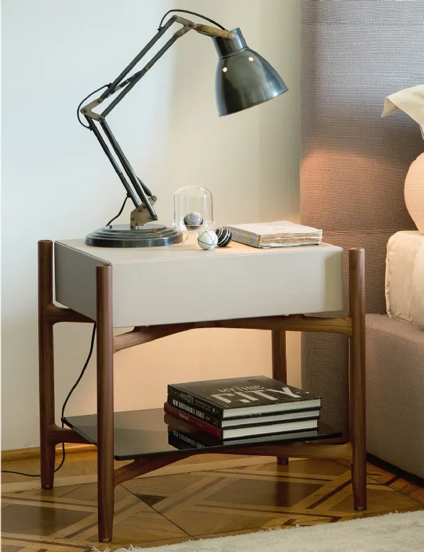 Regent bedside table in wood covered with leather by Porada
