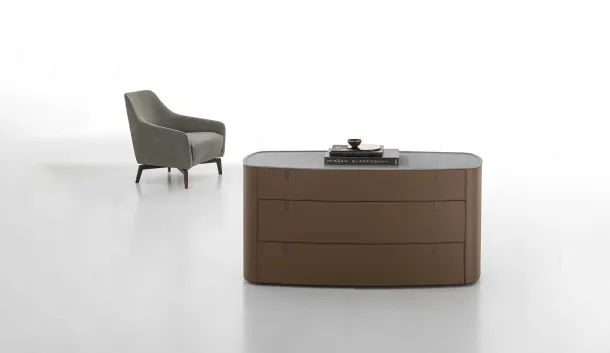 Round chest upholstered in leather with an acrylic stone top by Alivar