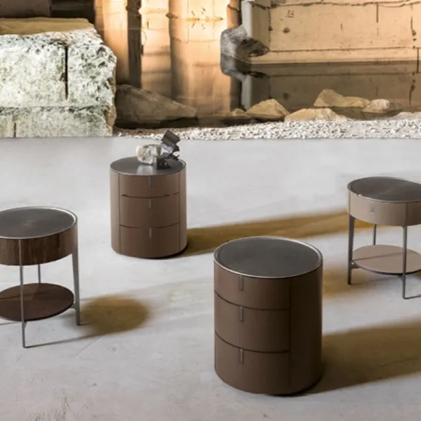 Round bedside table upholstered in leather with a steel top by Alivardi Alivar
