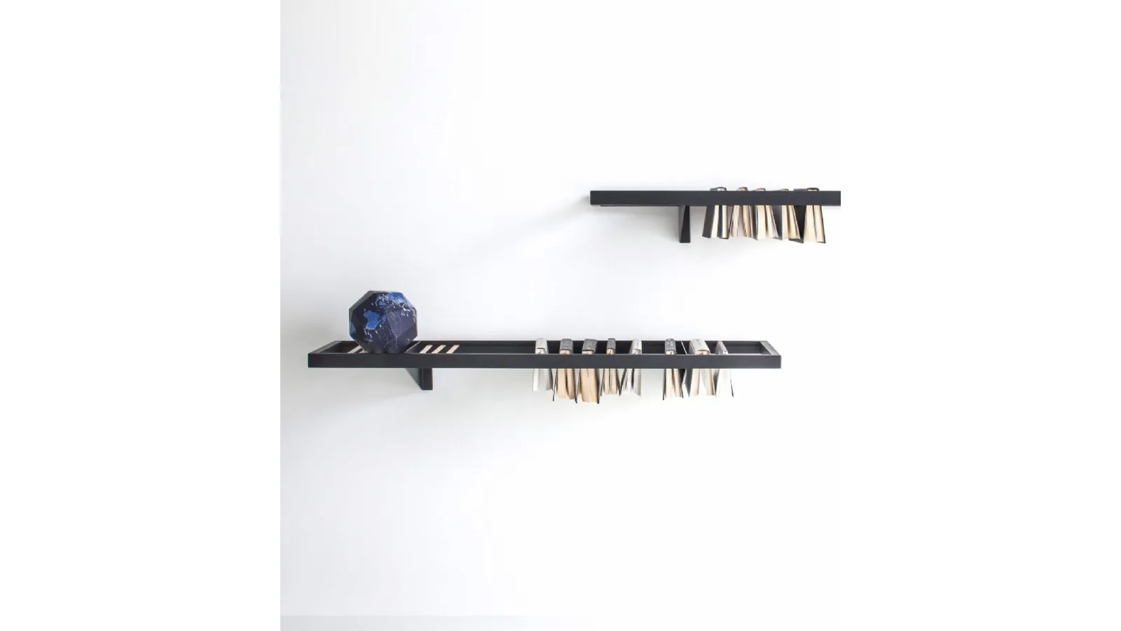 Booken wall-mounted bookshelf by Lema