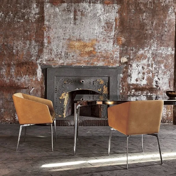 Fixed chair with chrome-plated aluminum legs and Denise leather seat by Alivar