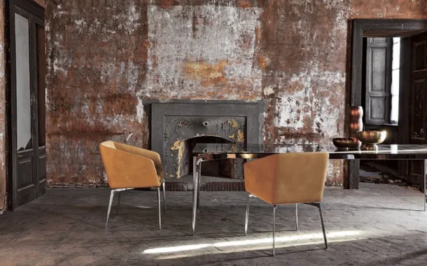 Fixed chair with chrome-plated aluminum legs and Denise leather seat by Alivar