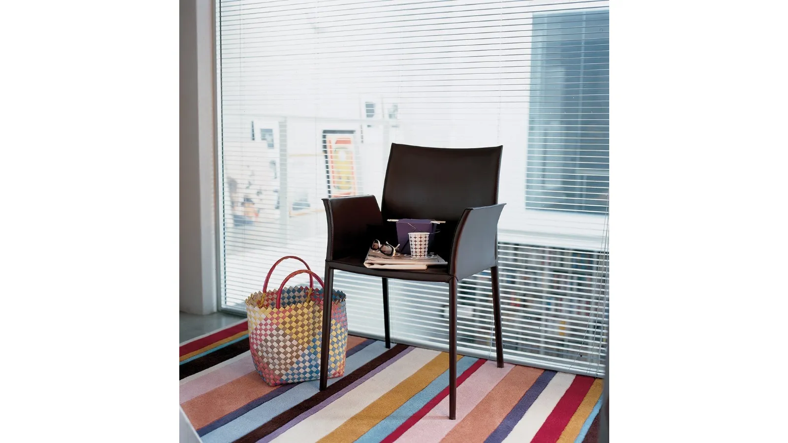 Chair with aluminum structure upholstered in leather with Lea armrests by Zanotta