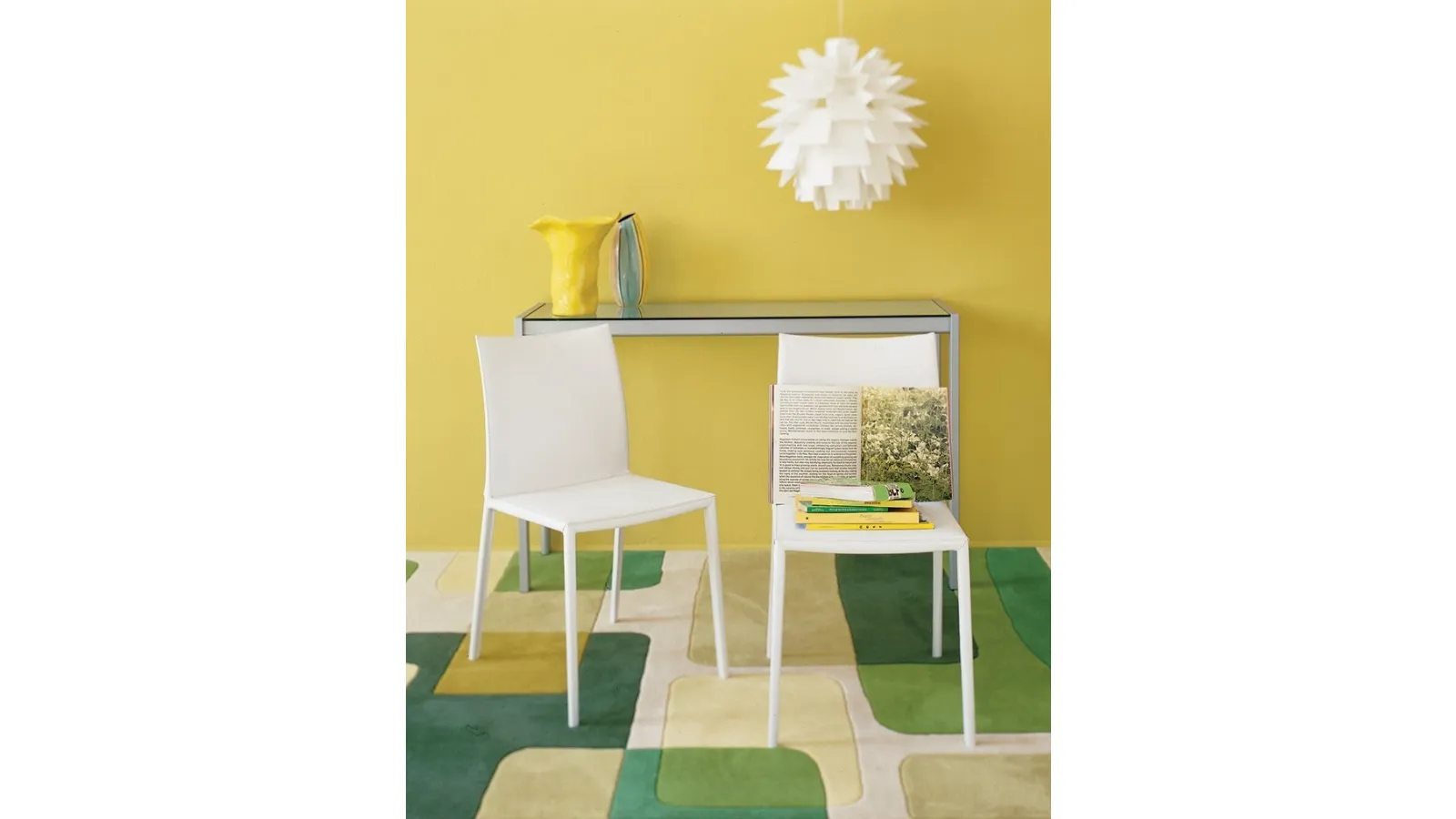 Lea armless chair by Zanotta with aluminum frame upholstered in white leather