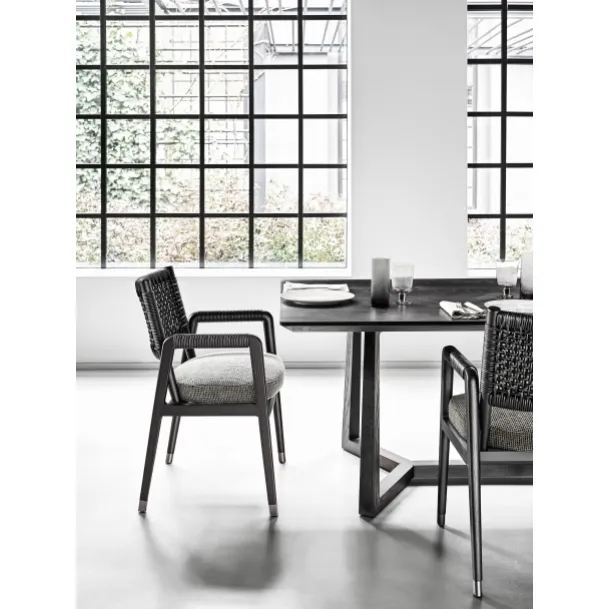 Ortigia Chair with solid wood frame, woven leather backrest, and upholstered fabric seat by Flexform