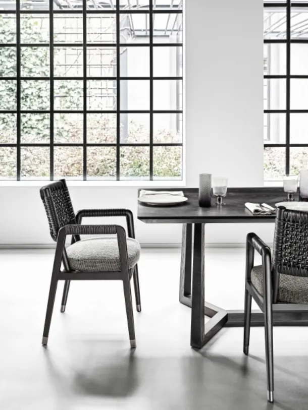 Ortigia Chair with solid wood frame, woven leather backrest, and upholstered fabric seat by Flexform