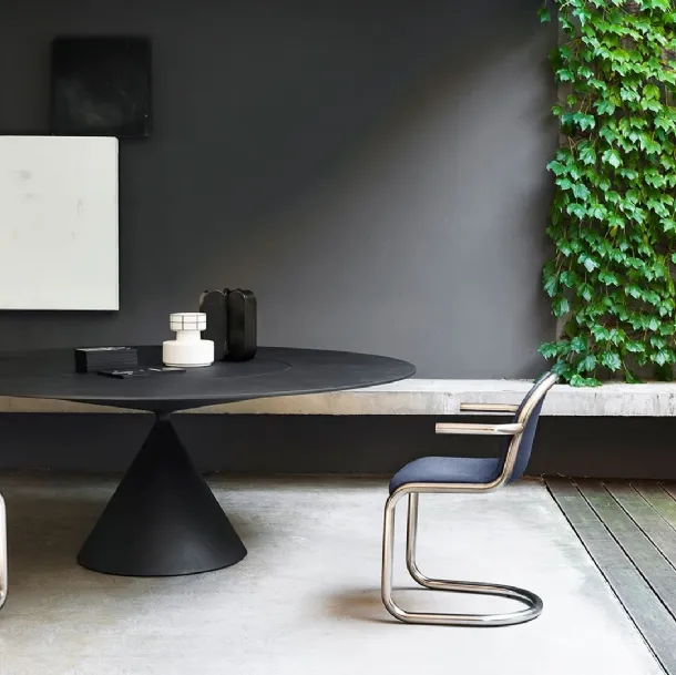 Armchair Strong with a bent steel tube frame and upholstered seat covered in Desalto fabric