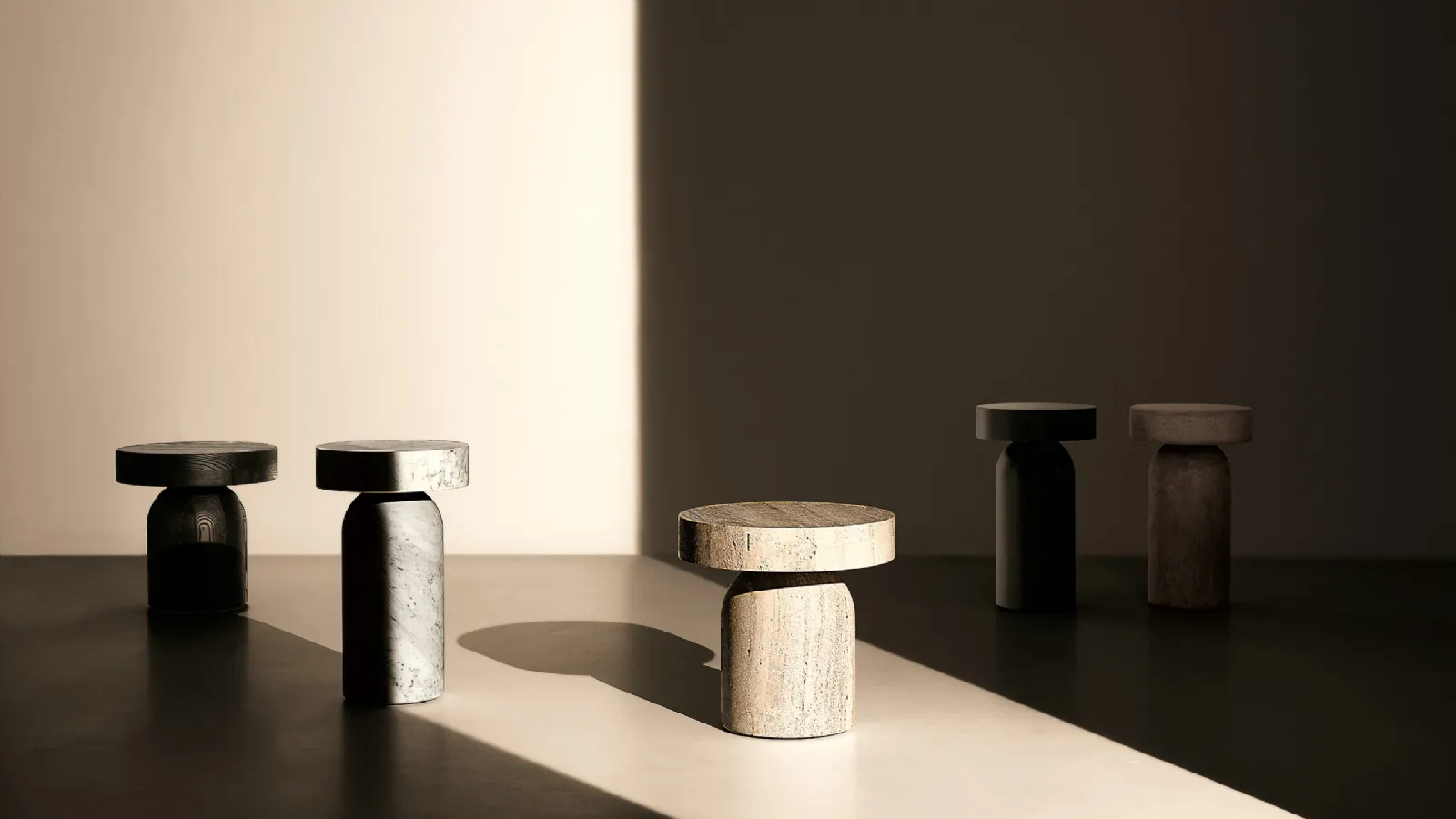 Monolithic Francis side tables in marble or wood by Lema