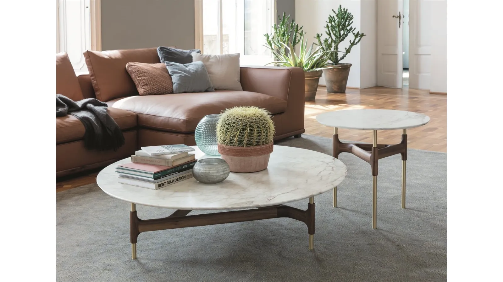 Round coffee table with a brass base, featuring a solid wood decorative element and a Joint marble top by Porada