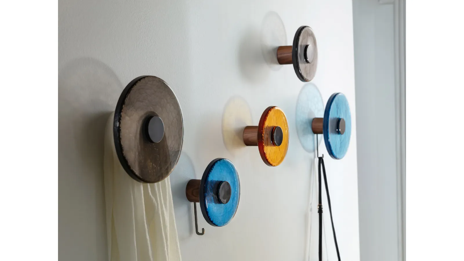 Wall-mounted coat rack with solid Canaletto walnut structure and Jupiter fused glass disc by Porada