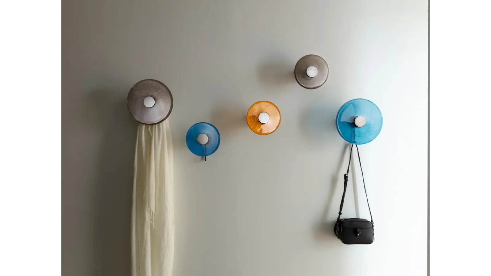 Wall-mounted coat rack with solid Canaletto walnut structure and Jupiter fused glass disc by Porada