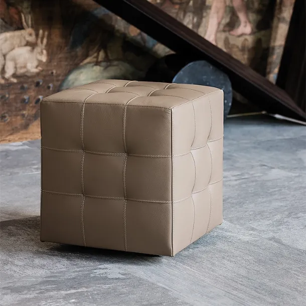Bob pouf on wheels, padded and upholstered in leather with a capitonné finish by Cattelan Italia