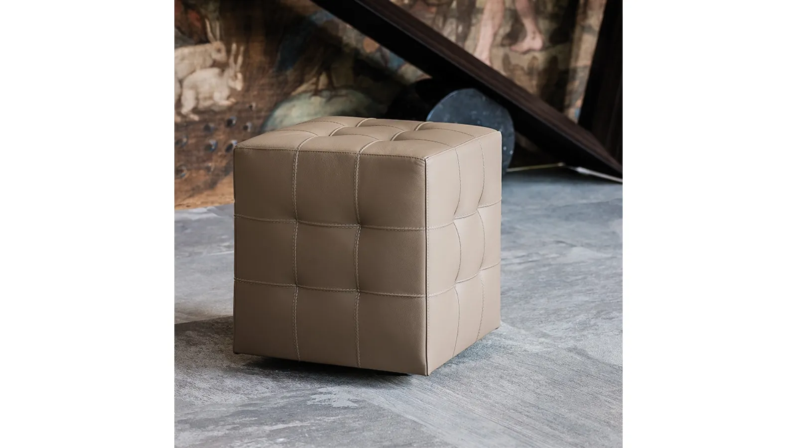 Bob pouf on wheels, padded and upholstered in leather with a capitonné finish by Cattelan Italia