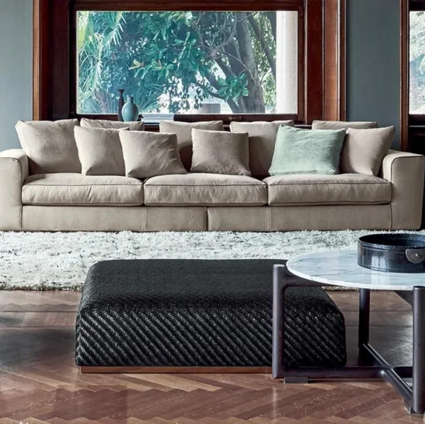Carmen pouf in braided leather with metal base by Flexform