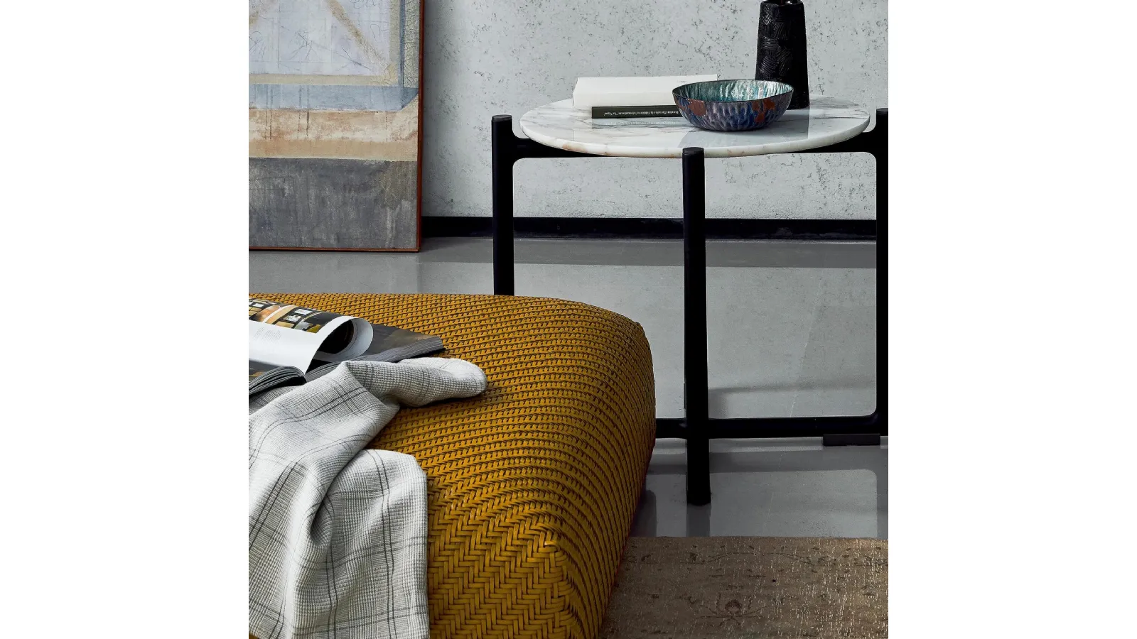 Carmen pouf in braided leather with metal base by Flexform