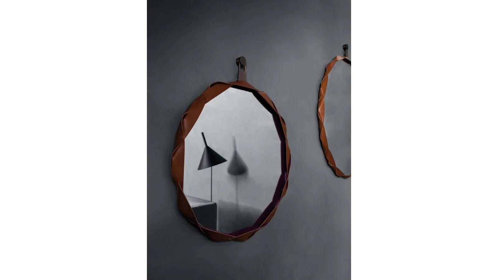 Mirror with braided leather frame Raperonzolo by Zanotta