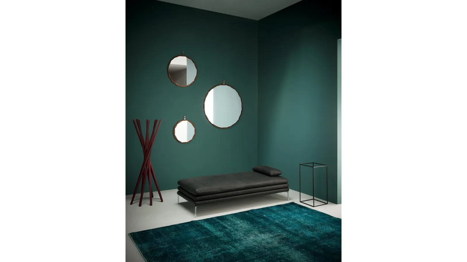Glass mirror with a braided leather frame available in three sizes Raperonzolo by Zanotta