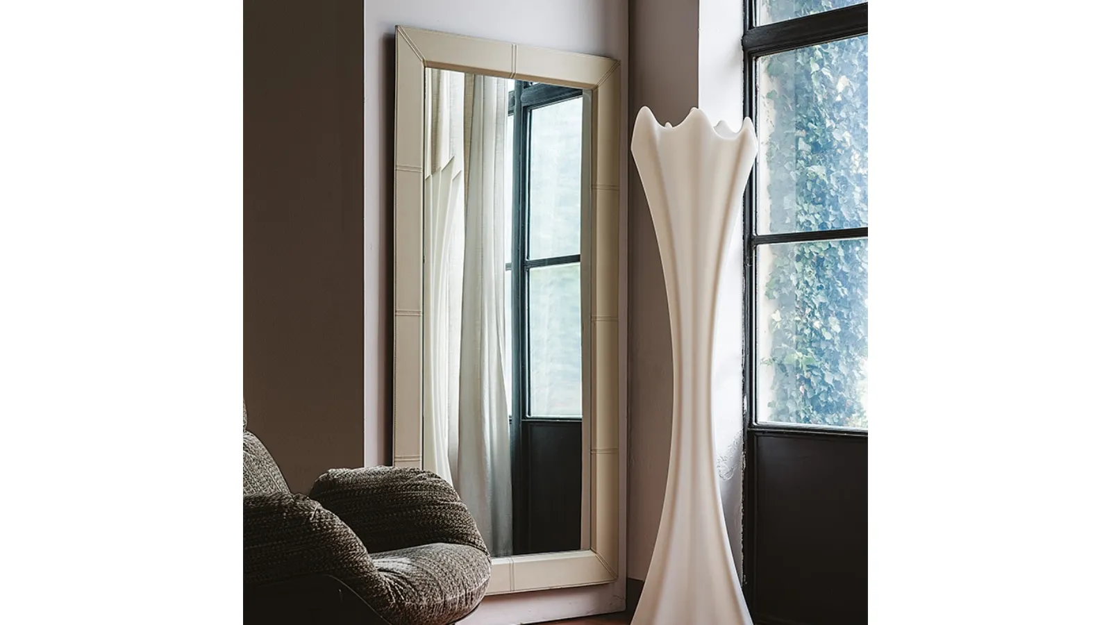 Mirror with leather frame Photo by Cattelan Italia