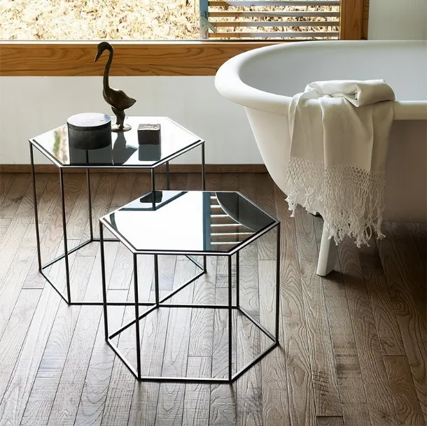 Hexagon side table inspired by the honeycomb grid with a steel structure and ground glass tops by Desalto