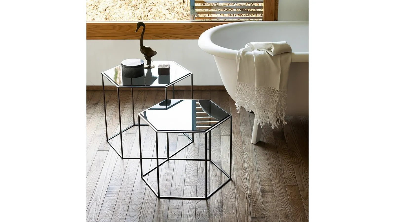 Hexagon side table inspired by the honeycomb grid with a steel structure and ground glass tops by Desalto