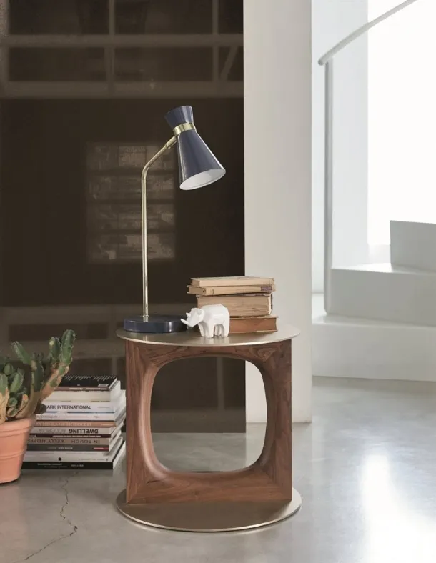 Design coffee table with a central support in solid Canaletto walnut and a metal top and base with brushed Tenco brass finish by Porada