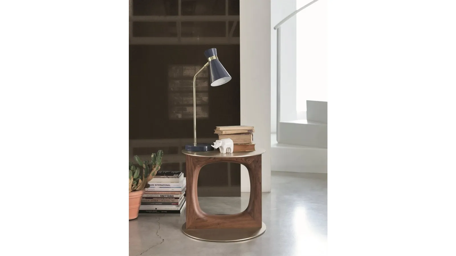Design coffee table with a central support in solid Canaletto walnut and a metal top and base with brushed Tenco brass finish by Porada