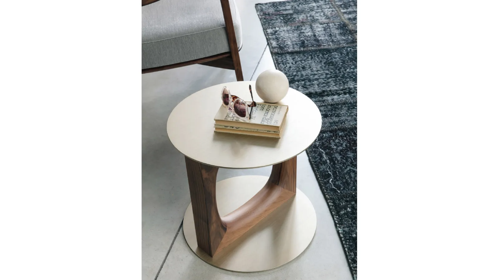 Design coffee table with a central support in solid Canaletto walnut and a Tenco metal top and base by Porada
