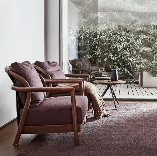 Alison upholstered fabric armchair with solid wood structure and Flexform leather trim