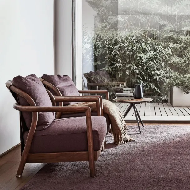 Alison upholstered fabric armchair with solid wood structure and Flexform leather trim