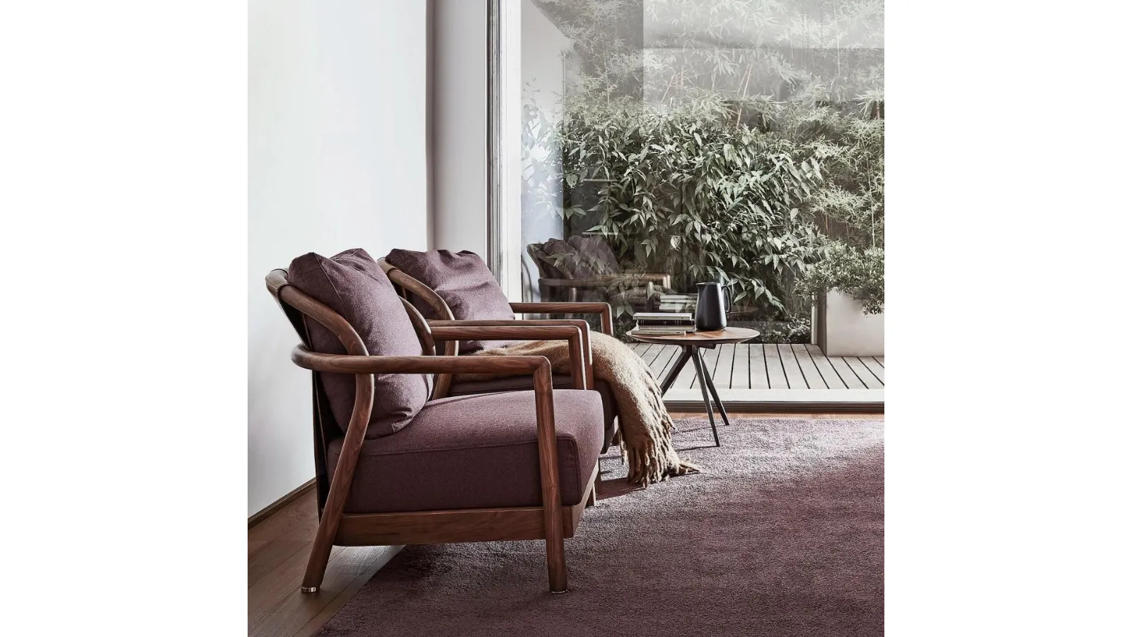Alison upholstered fabric armchair with solid wood structure and Flexform leather trim