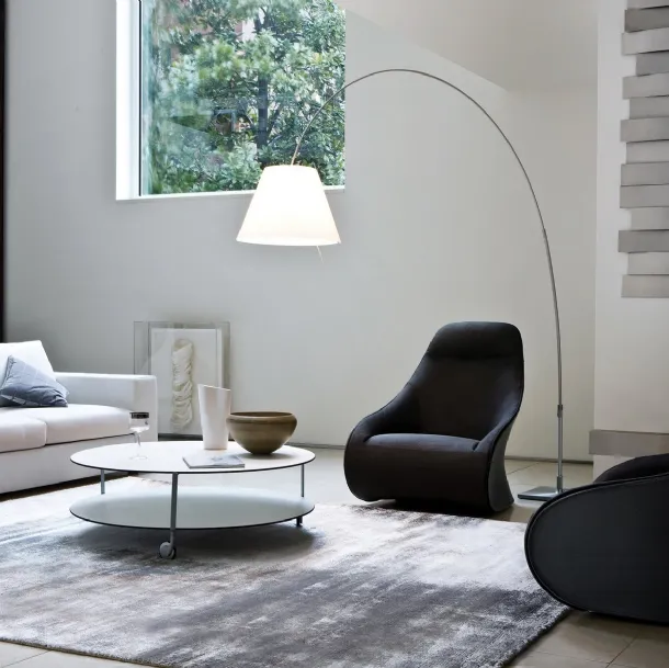 Design armchair in fabric with a shell upholstered in Zanotta's Derby leather