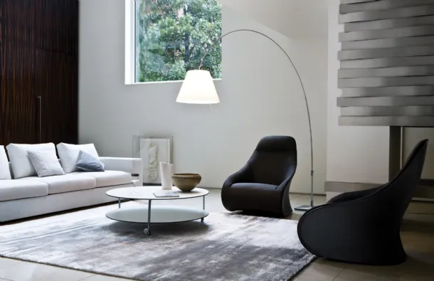 Design armchair in fabric with a shell upholstered in Zanotta's Derby leather