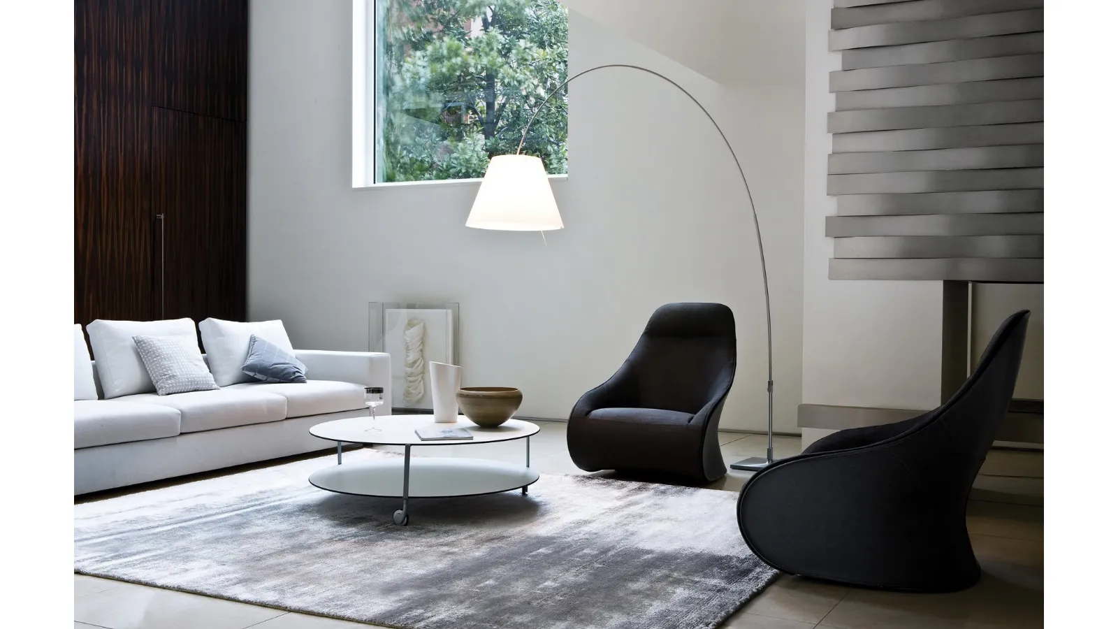 Design armchair in fabric with a shell upholstered in Zanotta's Derby leather