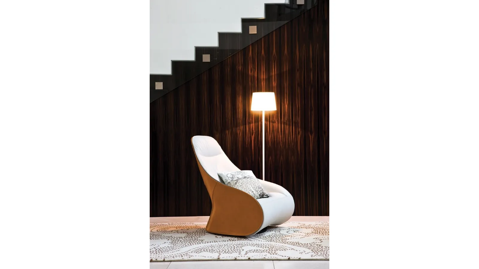 Design armchair in fabric with a Derby leather shell by Zanotta