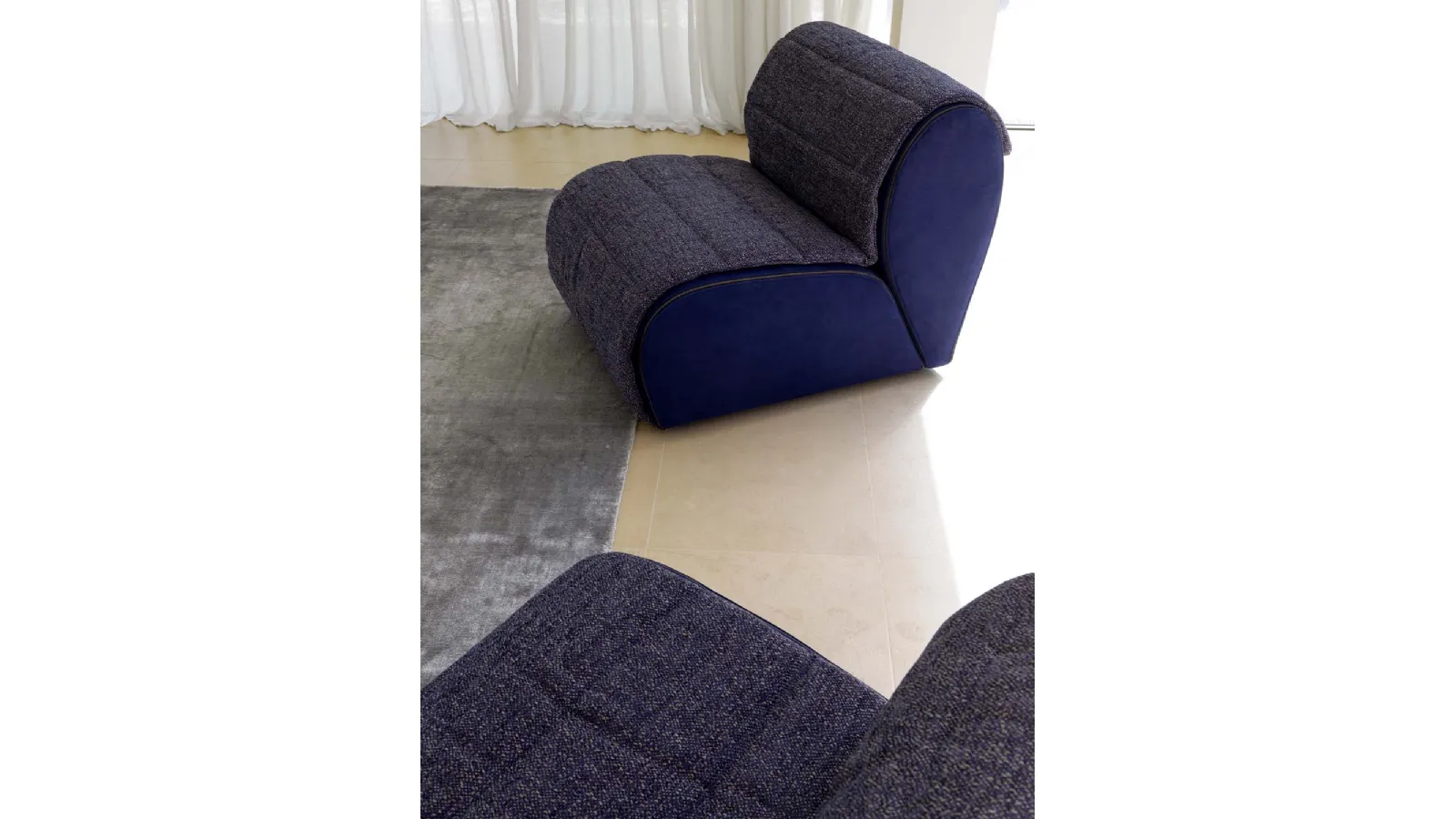 Fabric armchair inspired by the petals of a flower Flora by Flou
